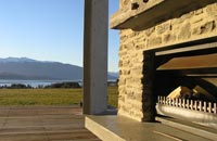 Enjoy a summer evening outside by the fire at Prospect Lodge accommodation Te Anau
